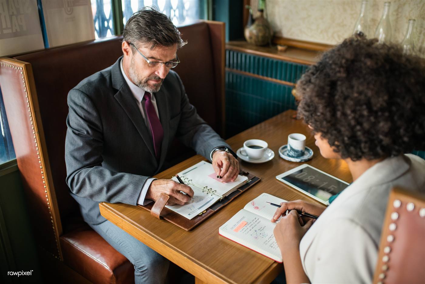 Business professionals in discussion around a table