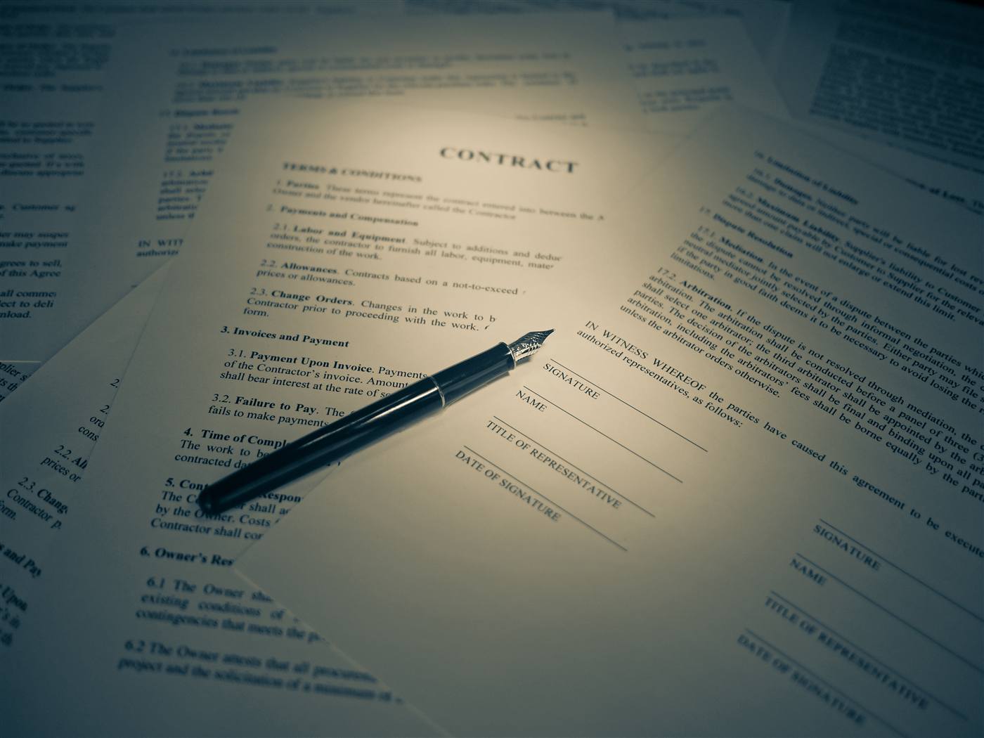 Documents on a desk, black and white